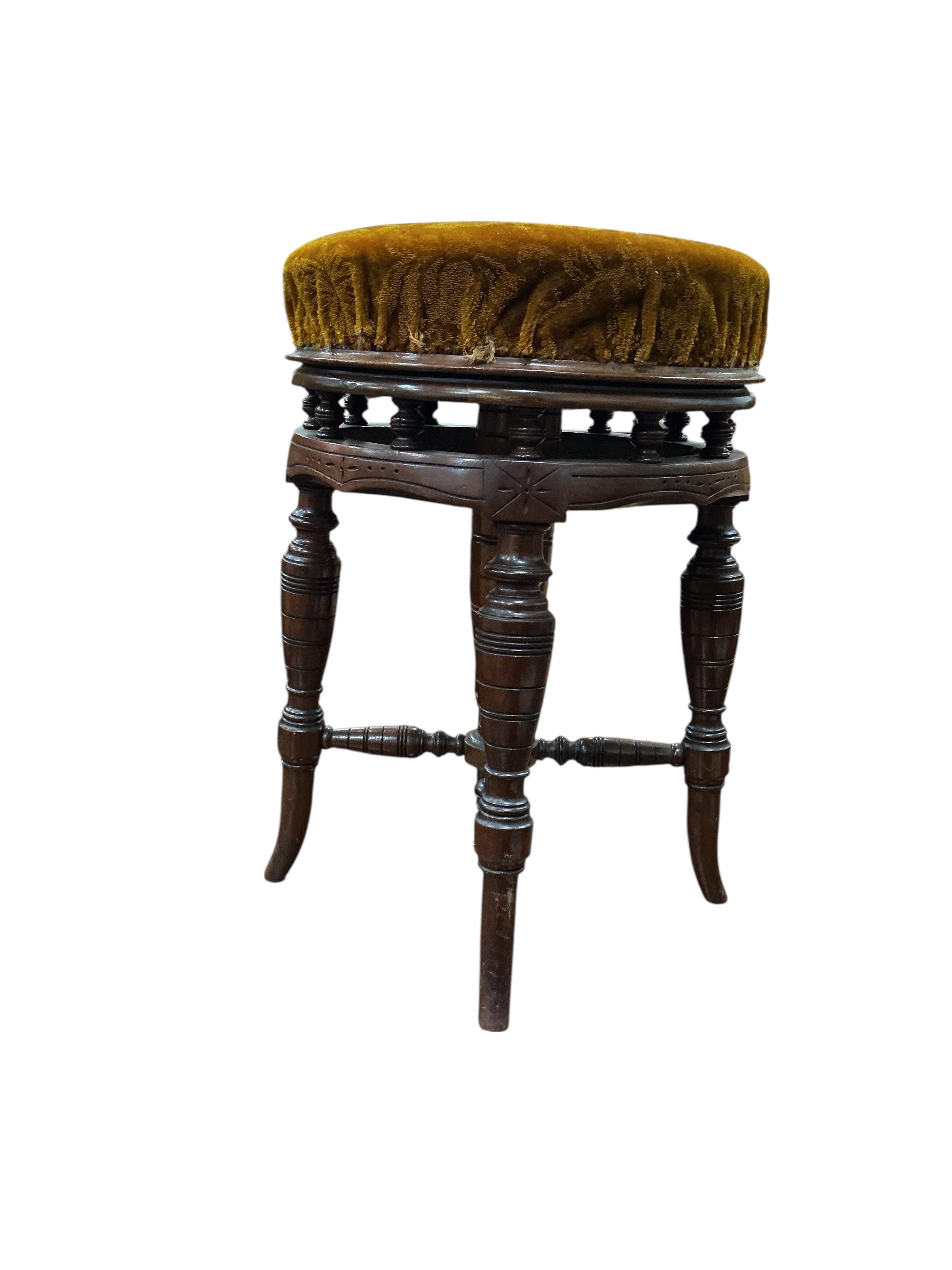 A late Victorian mahogany adjustable revolving piano stool